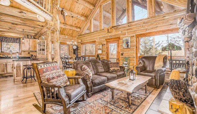 Delightful Riverfront Cabin with Wood-Burning Fireplace and Gas Grill & Hot Tub in Thompsonville