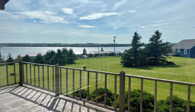 Ocean view cottage with a perfect wrap around deck to watch beautiful sunsets. in Breadalbane