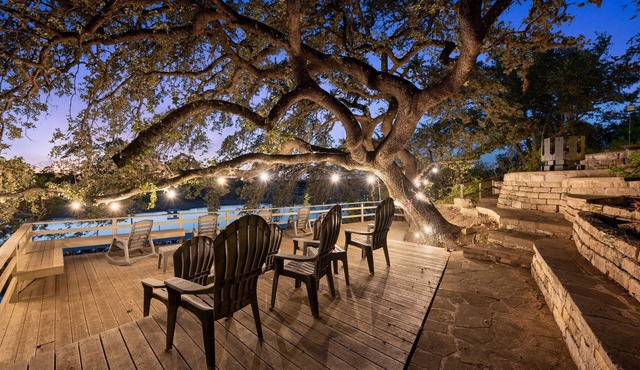 SPECTACULAR LAKEFRONT OASIS Over 400 feet frontage on 2 acres of century oaks in Austin